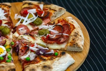 The most acclaimed, traditional and popular Brazilian pizza, half pepperoni calabresa and half Portuguese