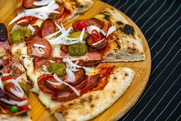 The most acclaimed, traditional and popular Brazilian pizza, half pepperoni calabresa and half Portuguese