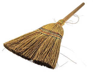 A broom angled against white