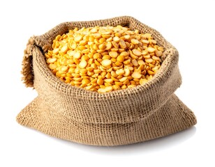 A burlap sack filled with yellow split peas against a white background