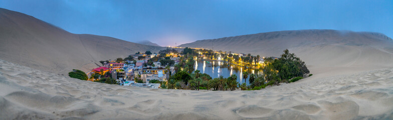 Oasis Huacachina high resolution wide angle panoramic landscape. Sand dunes dry desert in Peru....