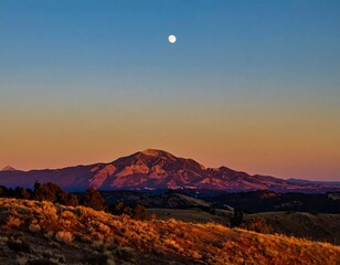 Mountainous landscape at twilight with moon
