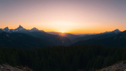 Obraz premium Majestic mountain range silhouetted against a vibrant orange and pink sunset sky