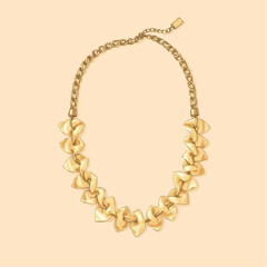 Obraz premium Elegant illustration of a gold statement necklace with a unique design, showcasing craftsmanship and style, against a soft peach background