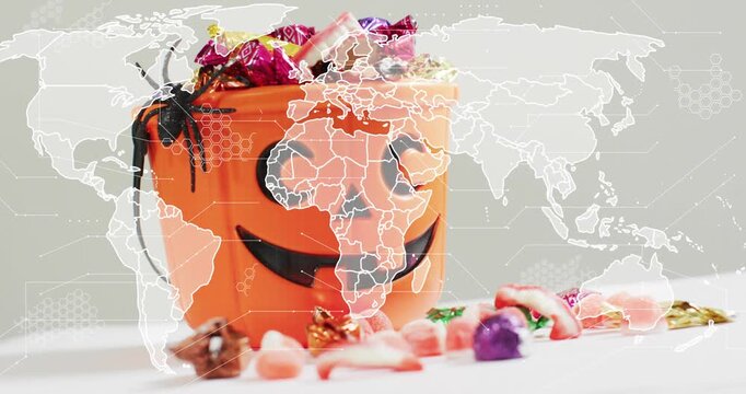 map outline fading over jack-o-lantern candy bucket, pulsing network representing global connection
