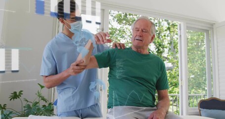 Physical therapist holding patient arm on bench and guiding shoulder abduction for muscle warming