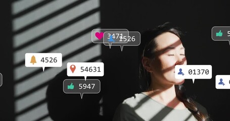 Woman standing as sunlight band sweeping face initiating social notifications swirling then fading - Powered by Adobe