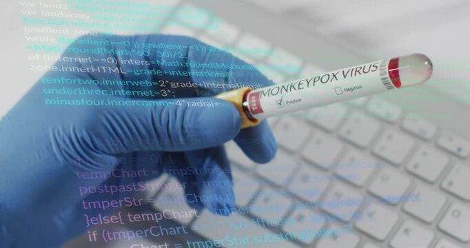 Gloved lab hand entering lifting monkeypox tube showing positive result as code overlay scrolling