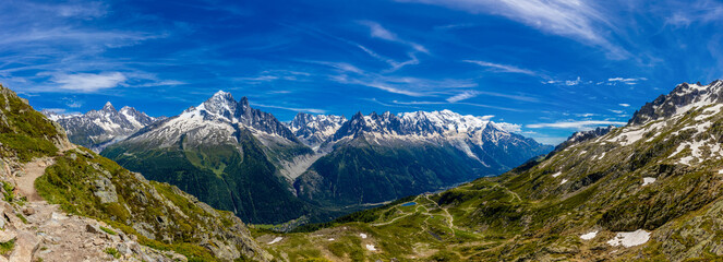 Mountain landscape of the Alps in Chamonix valley, France high resolution wide angle panoramic landscape. Alpine scenery in summer sunny weather on Tour du Mont Blanc, TMB trekking route