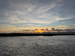 Naklejka premium sunset over the river