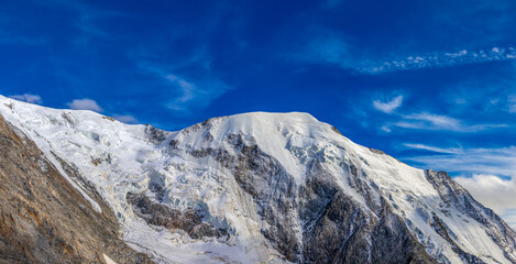 Mountain landscape of the Alps in Chamonix valley, France high resolution wide angle panoramic landscape. Alpine scenery in summer sunny weather on Tour du Mont Blanc, TMB trekking route
