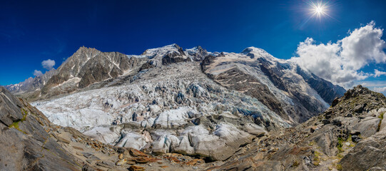 Mountain landscape of the Alps in Chamonix valley, France high resolution wide angle panoramic landscape. Alpine scenery in summer sunny weather on Tour du Mont Blanc, TMB trekking route