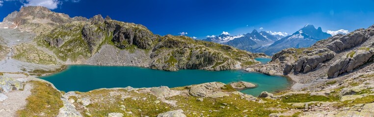 Mountain landscape of the Alps in Chamonix valley, France high resolution wide angle panoramic landscape. Alpine scenery in summer sunny weather on Tour du Mont Blanc, TMB trekking route
