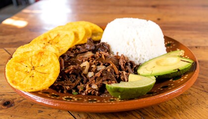Shredded beef, rice, fried plantains, avocado, and lime