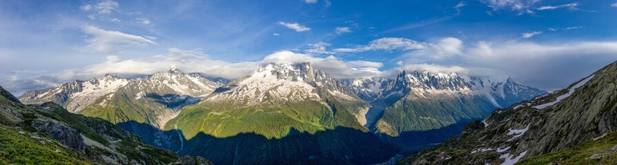 Mountain landscape of the Alps in Chamonix valley, France high resolution wide angle panoramic landscape. Alpine scenery in summer sunny weather on Tour du Mont Blanc, TMB trekking route