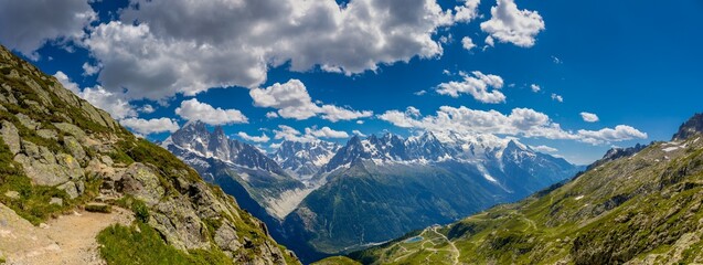 Mountain landscape of the Alps in Chamonix valley, France high resolution wide angle panoramic landscape. Alpine scenery in summer sunny weather on Tour du Mont Blanc, TMB trekking route