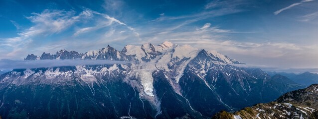 Mountain landscape of the Alps in Chamonix valley, France high resolution wide angle panoramic landscape. Alpine scenery in summer sunny weather on Tour du Mont Blanc, TMB trekking route