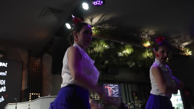 Spanish women in a vibrant dress dancing flamenco in Spain, hands gracefully clapping palmas