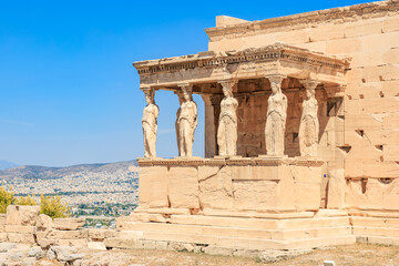 A building with statues of women on it, Acropolis in Athens