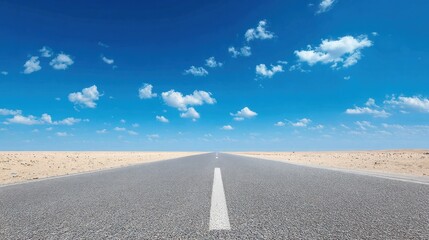 A long, straight road stretching into the distance with a clear blue sky above and a sandy desert landscape on either side.