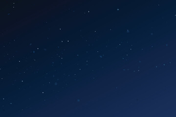 A dark blue night sky speckled with countless distant twinkling stars © MAYENUDDIN