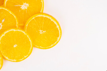 Cut citrus fruit creates abstract quadrant border showing texture and color contrast element.