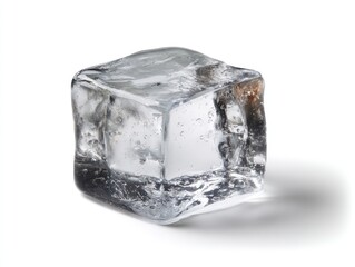 Obraz premium A single clear ice cube with bubbles inside sits on a white background, casting a soft shadow