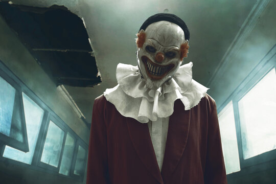 Man wearing scary clown mask, Halloween theme - Powered by Adobe