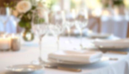 Elegant dining table setting blurred, soft focus, white linens, floral centerpiece, glassware, romantic atmosphere, beautiful decor, celebration, wedding, sophisticated event.