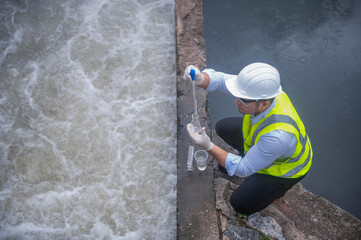 A water treatment plant specialist is checking the water quality to find any abnormalities in the water filtration system.