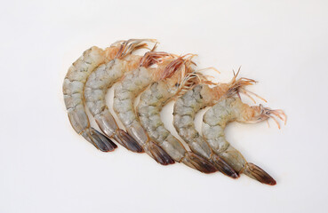 Peeled fresh raw shrimps isolated on white studio background.