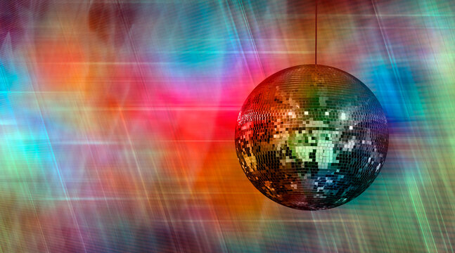 Party disco mirror ball reflecting orange and green lights