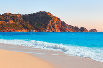 Beach of Cleopatra with sea and rocks of Alanya peninsula - Antalya, Turkey 