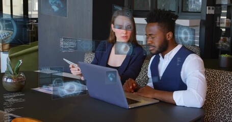 Colleagues typing on laptop, tapping tablet while 3D data charts expanding for business analysis - Powered by Adobe