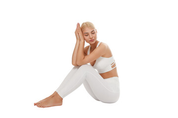 Woman in yoga wear meditating seated, isolated, PNG