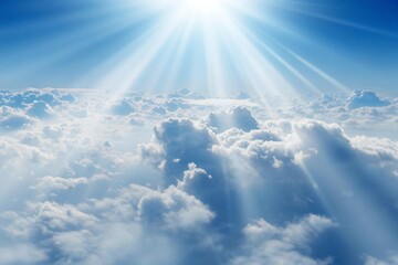 Breathtaking aerial view of fluffy white clouds meeting a vibrant blue sky with radiant sunbeams for a dreamy, heavenly escape, perfect for conveying peace and inspiration