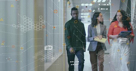 Team of three walking corridor generating tech layer discussing yellow folder and blue binders - Powered by Adobe