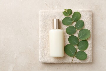 Natural Skin Care Product with Leaf on Towel Background