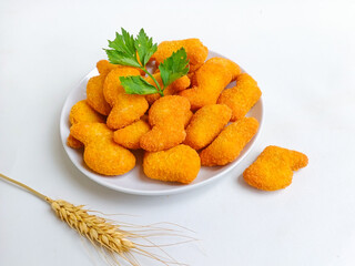 Chicken nuggets. Crunchy chicken nugget on the plate, isolated white background