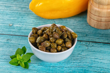 Pickled canned capers in the bowl