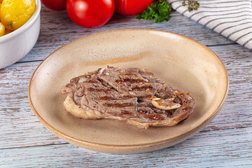 Grilled lamb steak with bone