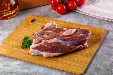 Raw lamb steak with bone