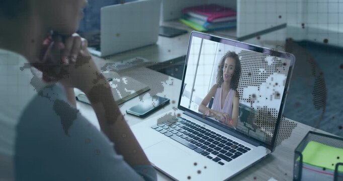 Viewer opening laptop and presenter using gestures outlining strategy with rotating map overlay