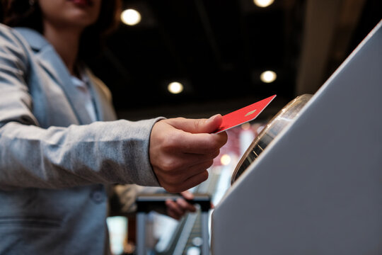 Woman paying contactless with credit card at terminal