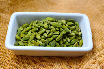 Green cardamom pods with aromatic and medicinal benefits.