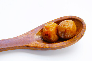 Pickled plums on white background.