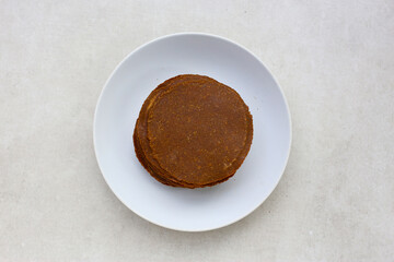 Fermented soybean discs, known as “Thua Nao,” a traditional Thai seasoning used to enhance flavor in Northern cuisine.