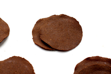 Fermented soybean discs, known as “Thua Nao,” a traditional Thai seasoning used to enhance flavor in Northern cuisine.
