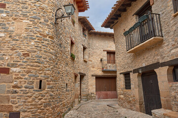 Picturesque stone alleys in the charming medieval village of Mirambel, Teruel, inviting exploration