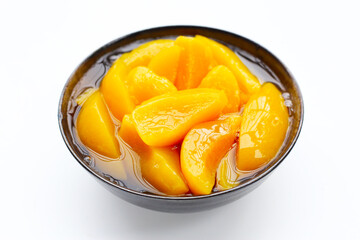 Sliced peaches in syrup served in a bowl
